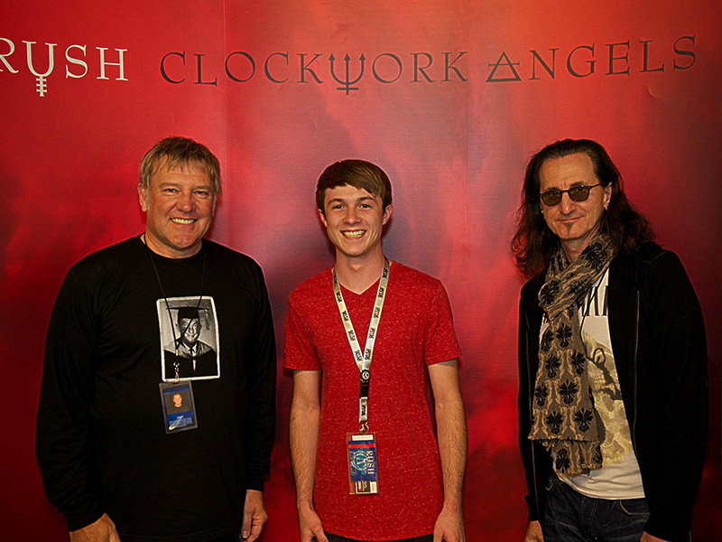 Joseph Kirkwood with Alex Lifeson and Geddy Lee from RUSH