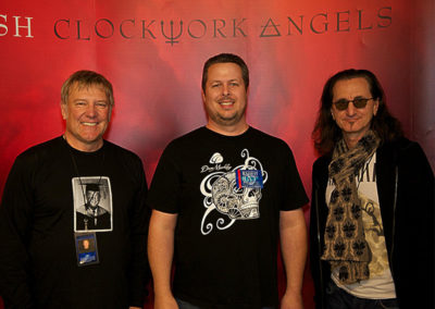 Clark Kirkwood with Alex Lifeson and Geddy Lee of RUSH