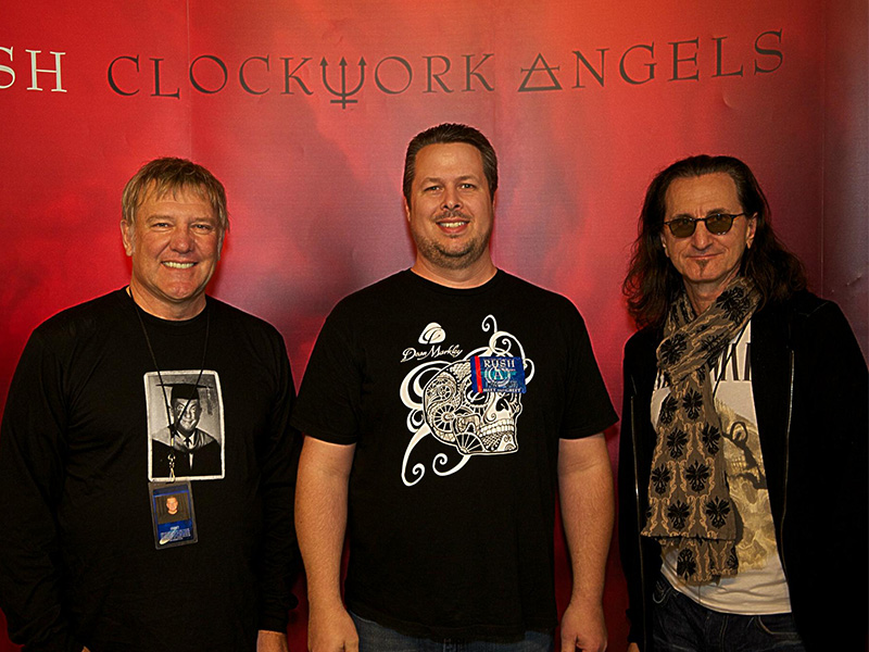 Clark Kirkwood with Alex Lifeson and Geddy Lee of RUSH